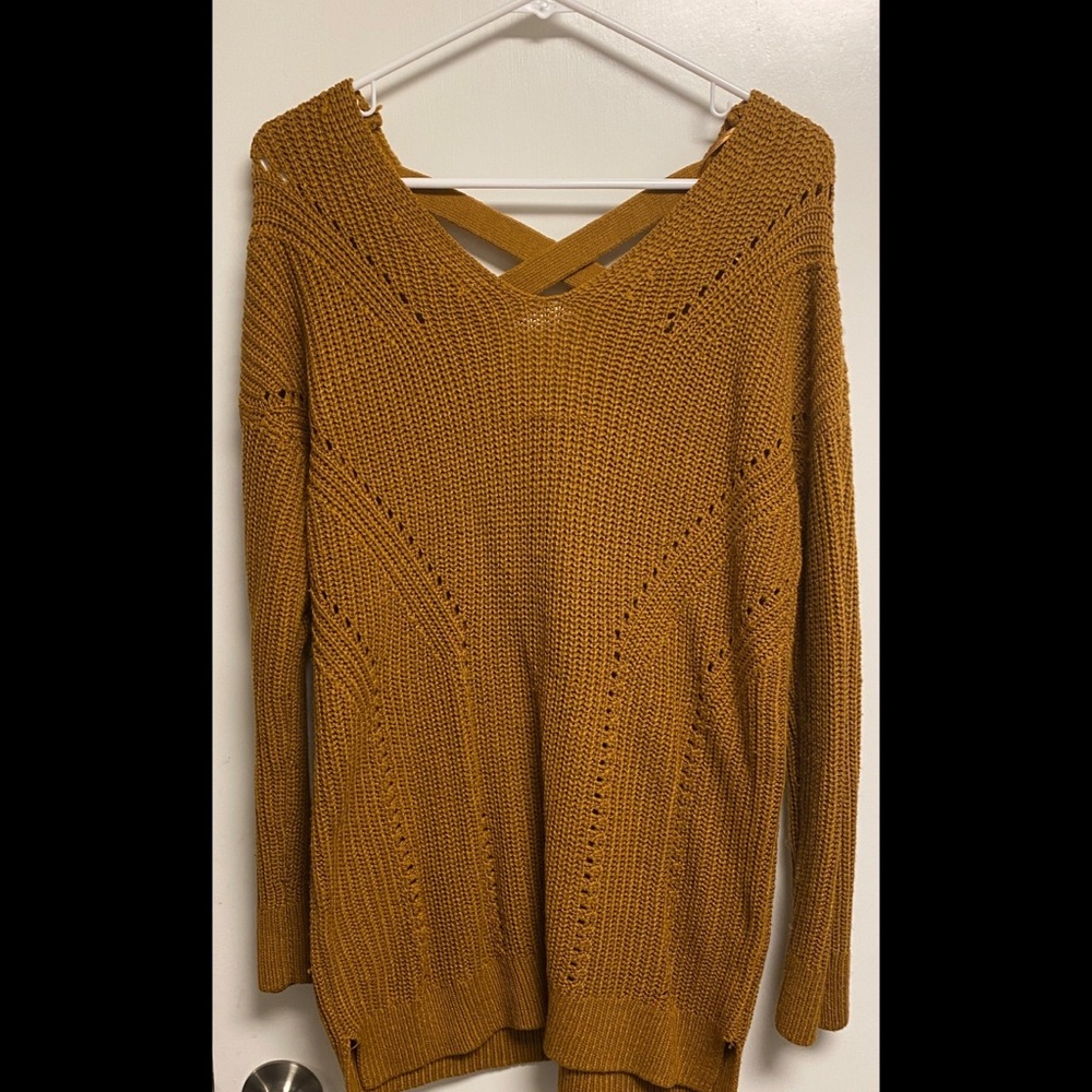 Pink rose light brownish colored sweater with twist design in back size large.